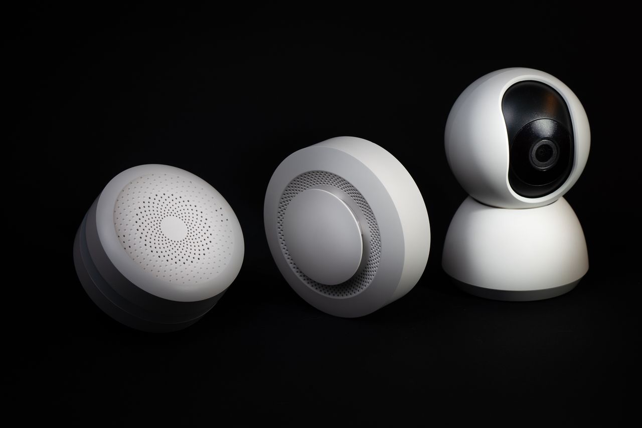 Elegant and innovative home automation devices on a sleek black background, showcasing modern technology.